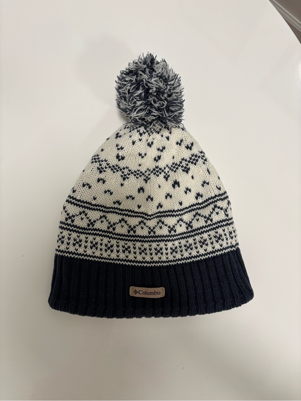 Columbia navy and white beanie with pom pom